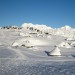 Pastirski stani na Veliki planini v panorami Kamniško-Savinjskih Alp